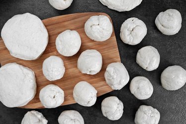 Roll biscuit dough into balls